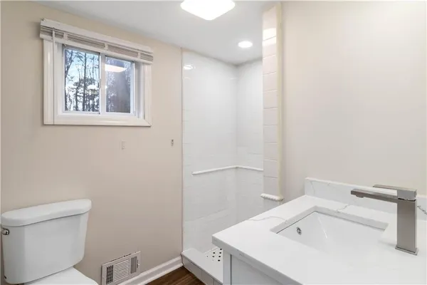 a bathroom with a sink and a toilet