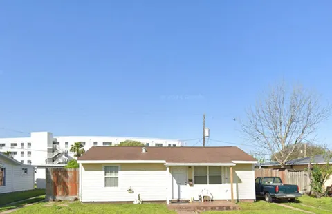 a view of house with yard