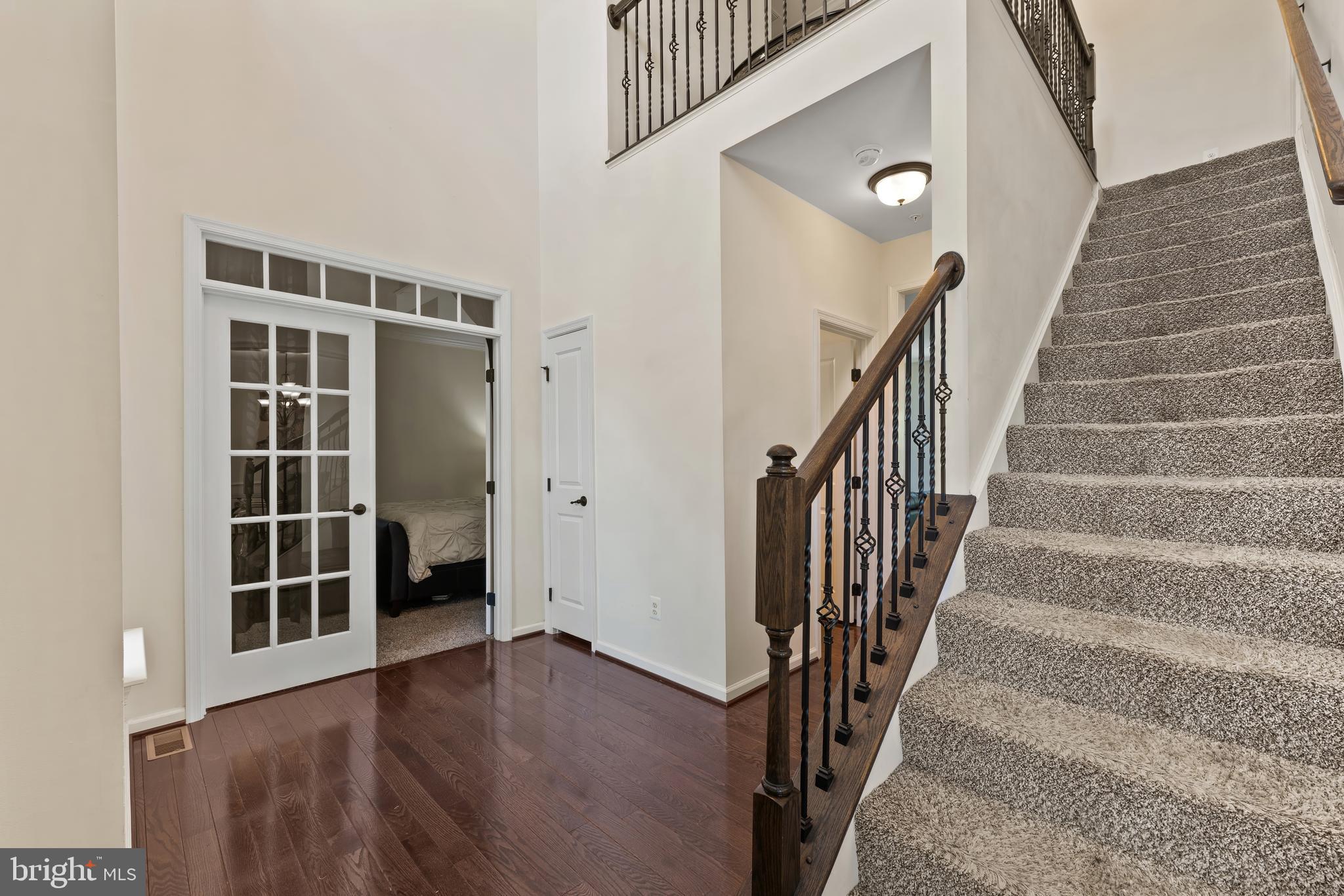 17857 Sugarberry Road Dumfries, VA 22026 - Photo 12 of 53 a view of staircase with wooden floor and a window