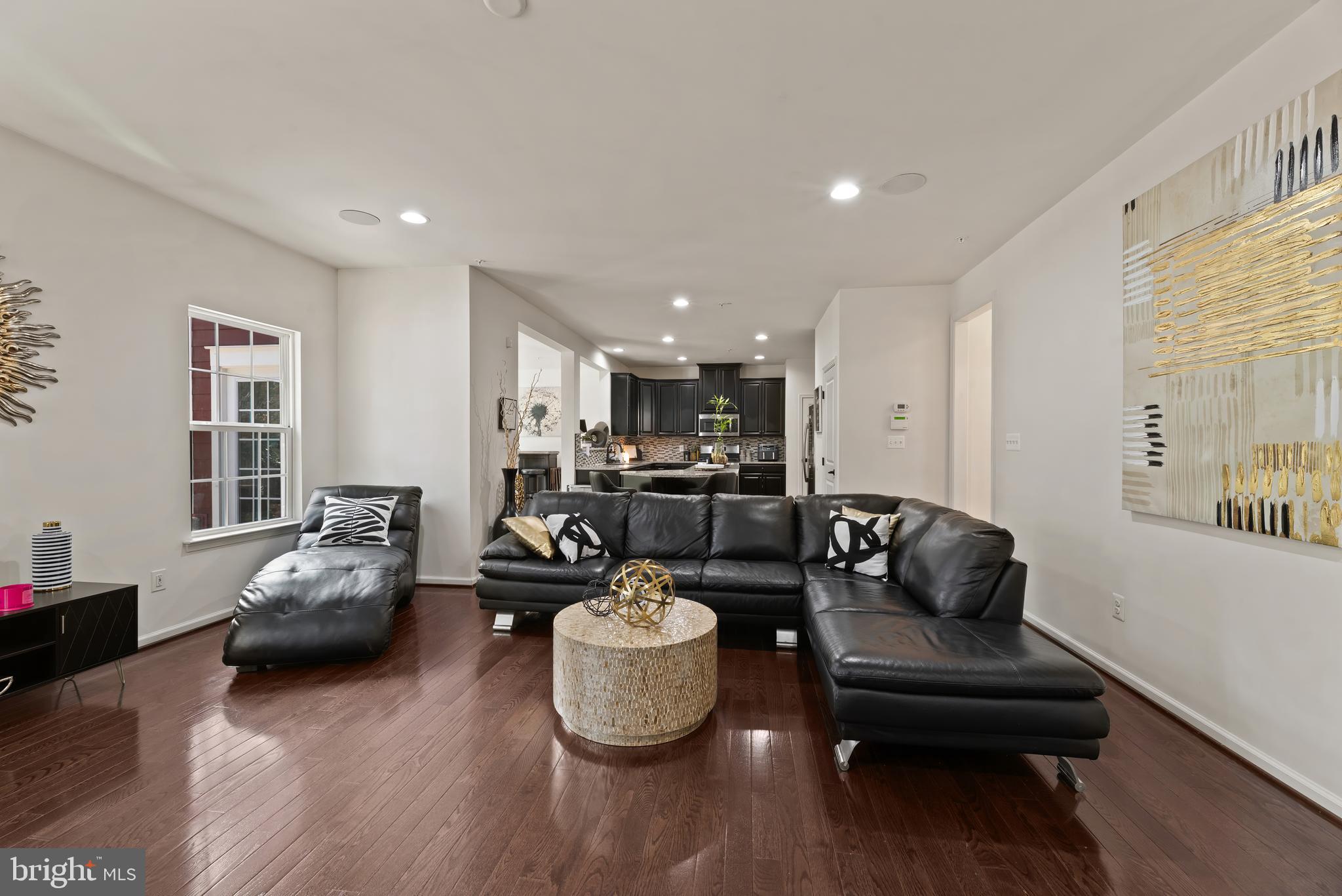 17857 Sugarberry Road Dumfries, VA 22026 - Photo 22 of 53 a living room with furniture and a wooden floor