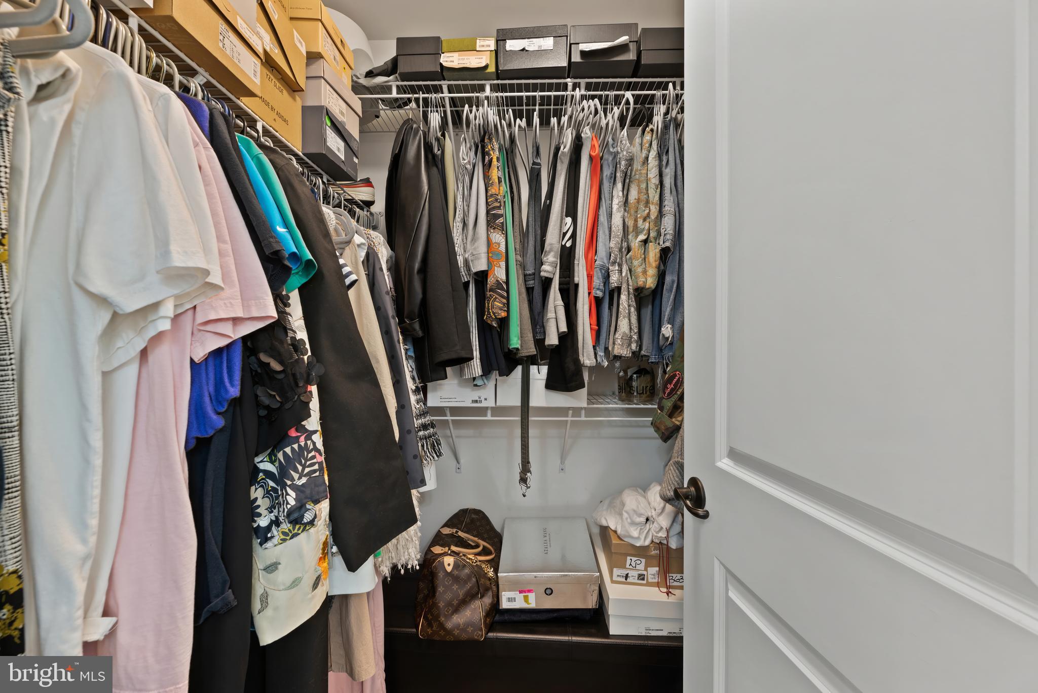 17857 Sugarberry Road Dumfries, VA 22026 - Photo 32 of 53 a view of walk in closet with clothes and shoes