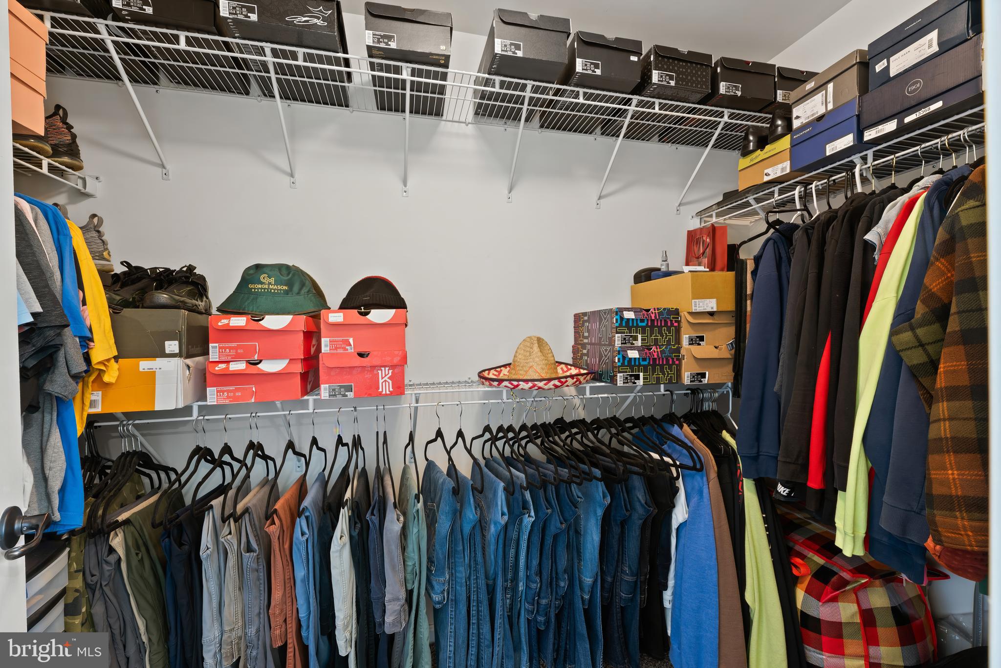 17857 Sugarberry Road Dumfries, VA 22026 - Photo 33 of 53 a view of walk in closet with clothes and shoes