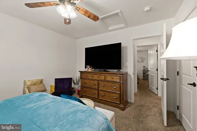 a bedroom with furniture and a window