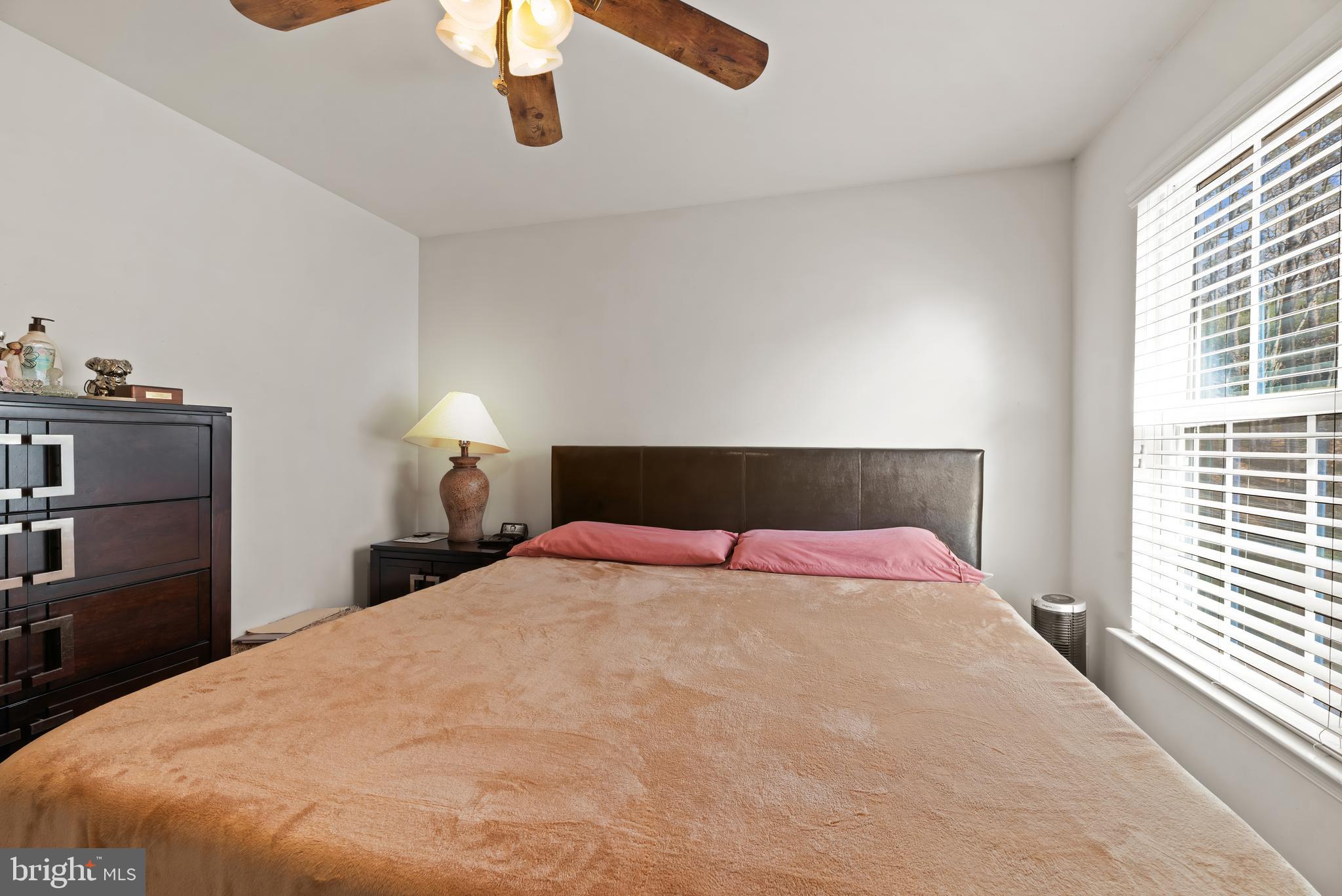 17857 Sugarberry Road Dumfries, VA 22026 - Photo 36 of 53 a bedroom with a bed and window