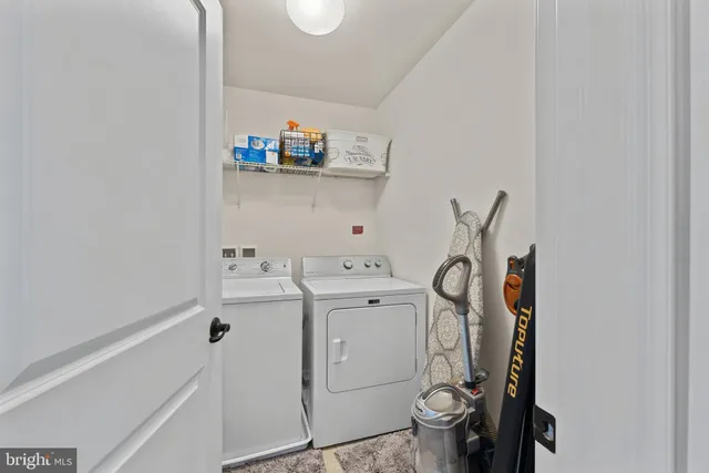 a view of a livingroom with workspace and a couch