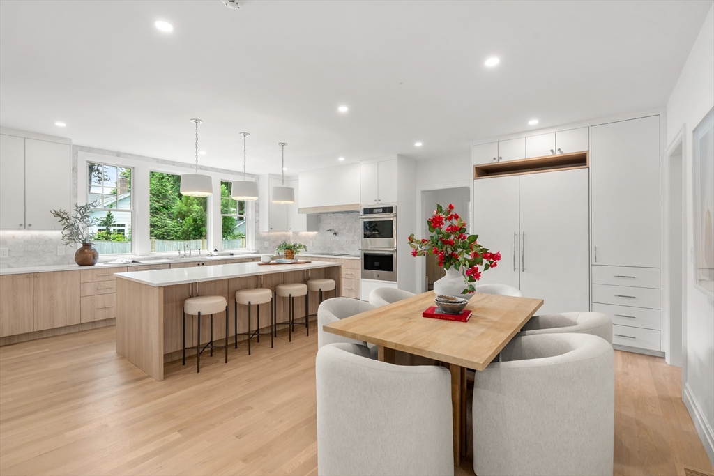 28 Parker Road Wellesley, MA 02482 - Photo 8 of 32 a kitchen with a table and chairs in it
