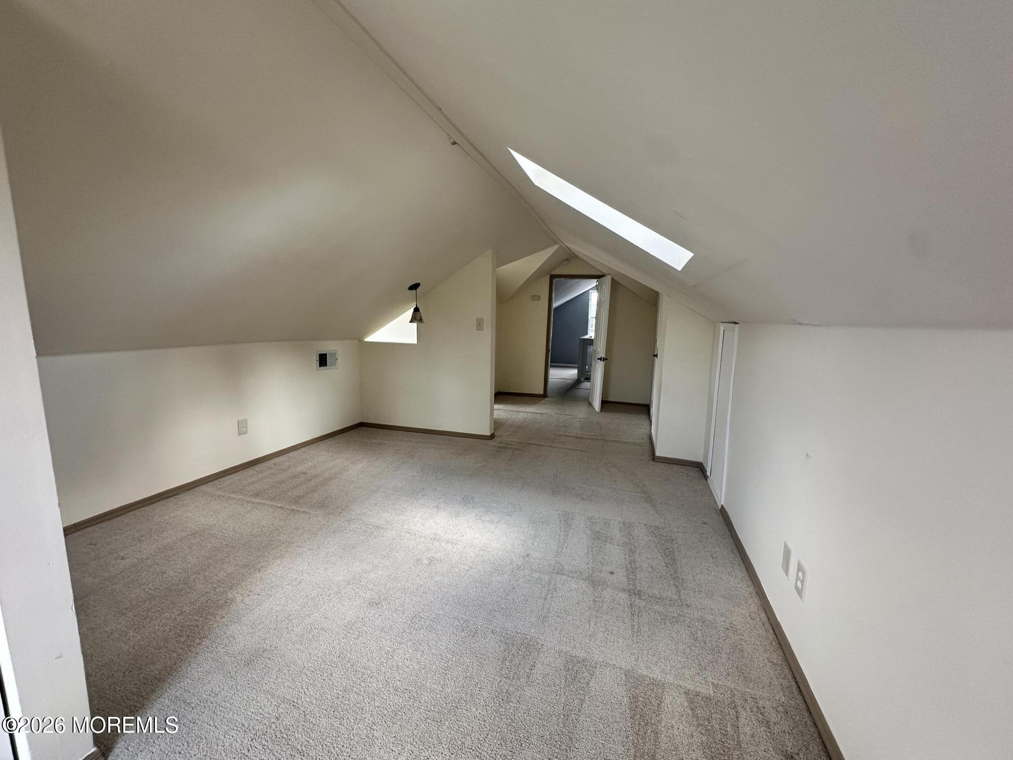 4 Spring Street Beachwood, NJ 08722 - Photo 27 of 31 a view of a big room with closet and chandelier