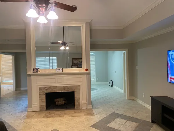 a view of an empty room and fire place