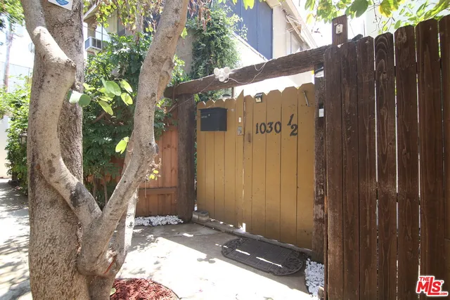 a view of a house with a tree