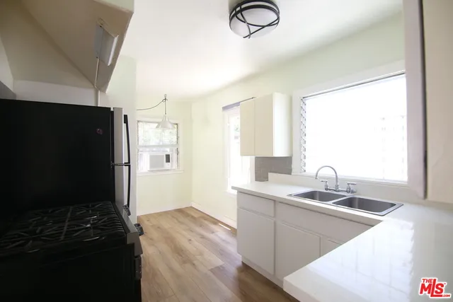 a bathroom with a sink and a shower