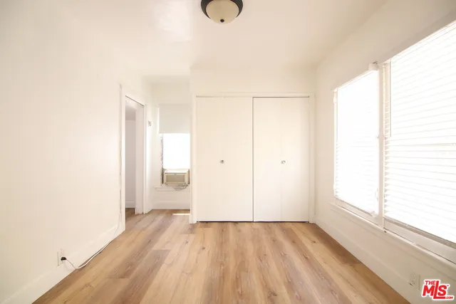a kitchen with a refrigerator and a stove