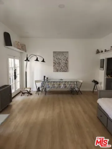 a view of bedroom with furniture and window