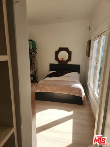 a view of a balcony with wooden floor