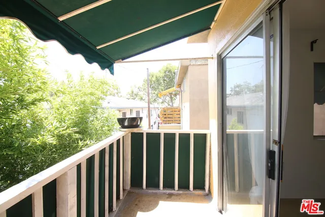 a view of a house with a potted plant