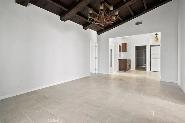 a view of a livingroom with a kitchen