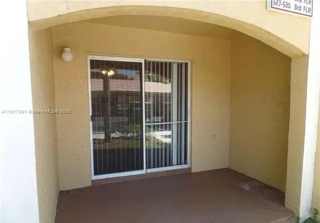 a view of a big room with windows