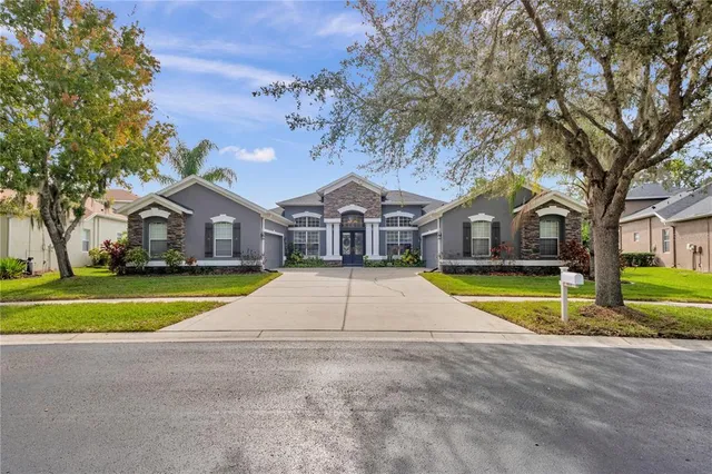 an aerial view of a house with a garden and plants