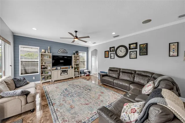 a large spacious bathroom with a double vanity sink a mirror and a toilet