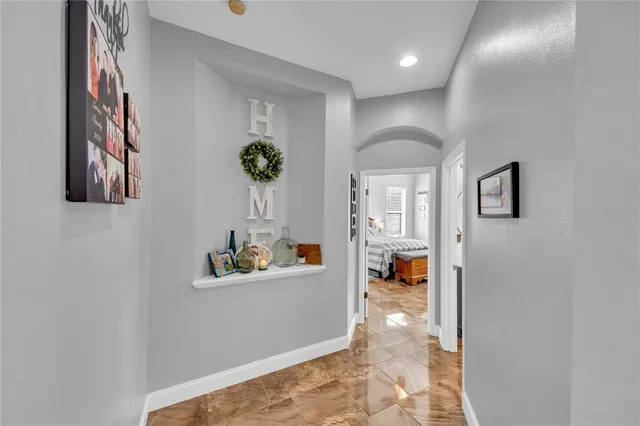 a view of a backyard with table and chairs under an umbrella