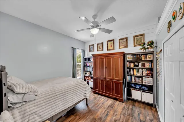 a living room with furniture a window and stainless steel appliances