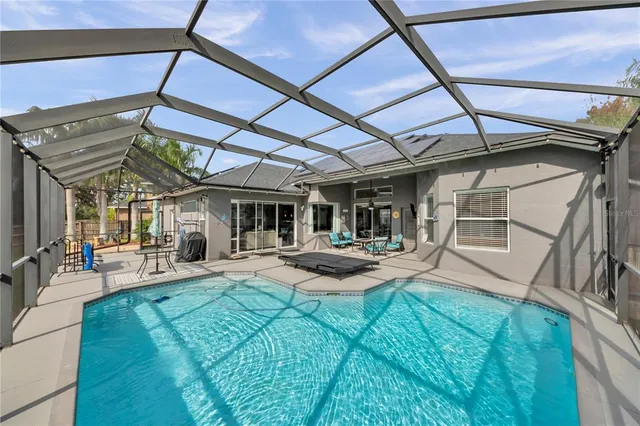 an aerial view of residential houses with outdoor space and street view