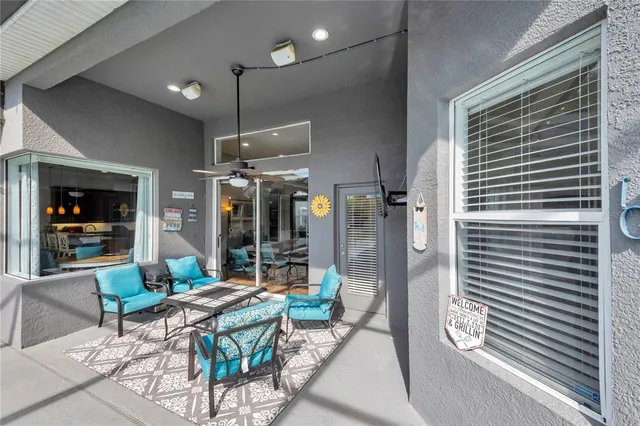 a dining room with furniture window and outside view