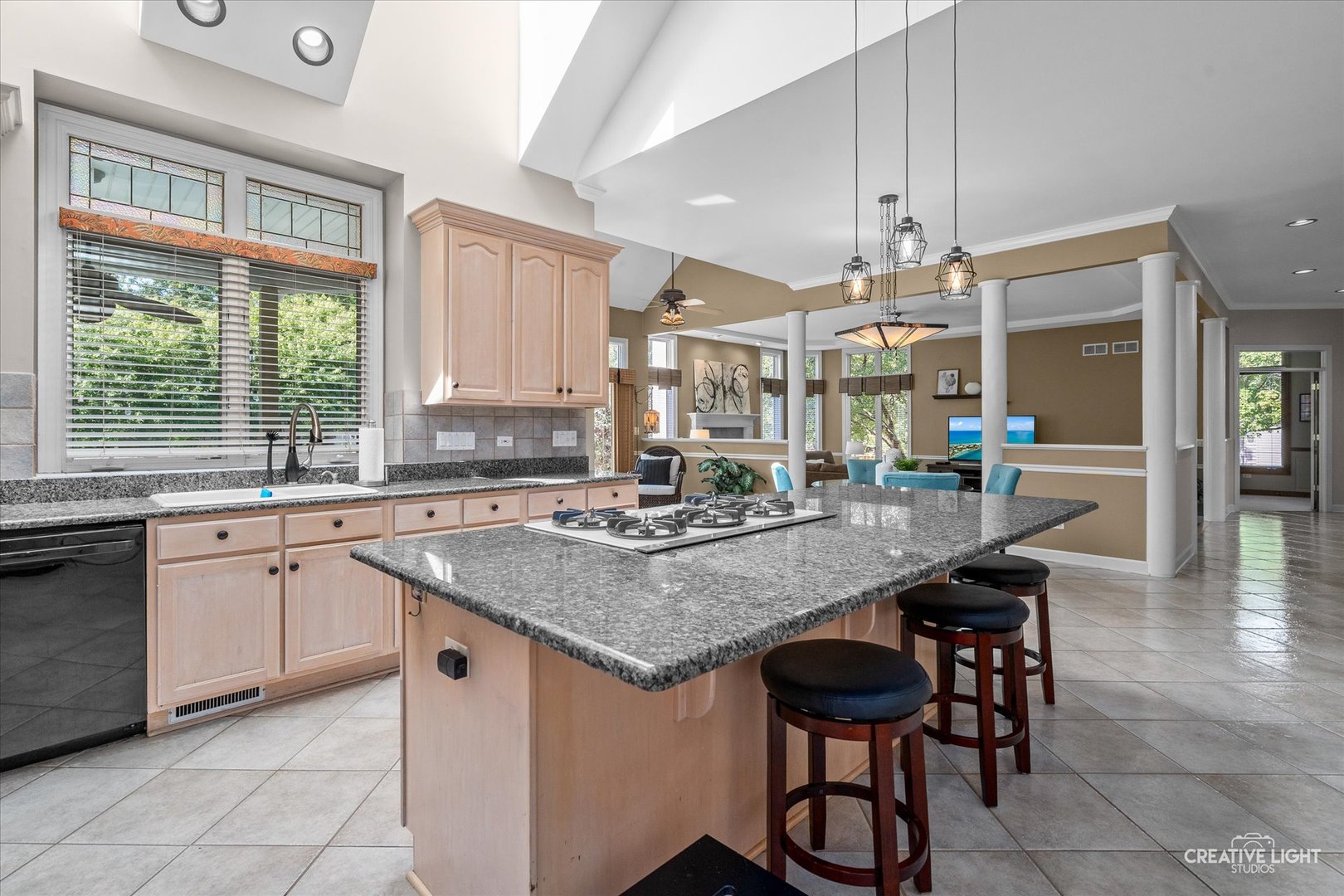 4811 Sebastian Court Naperville, IL 60564 - Photo 14 of 49 a kitchen with center island table and chairs in it