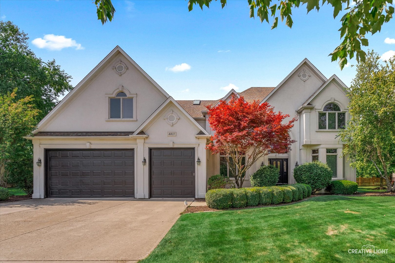 4811 Sebastian Court Naperville, IL 60564 - Photo 2 of 49 a front view of a house with a yard and garage