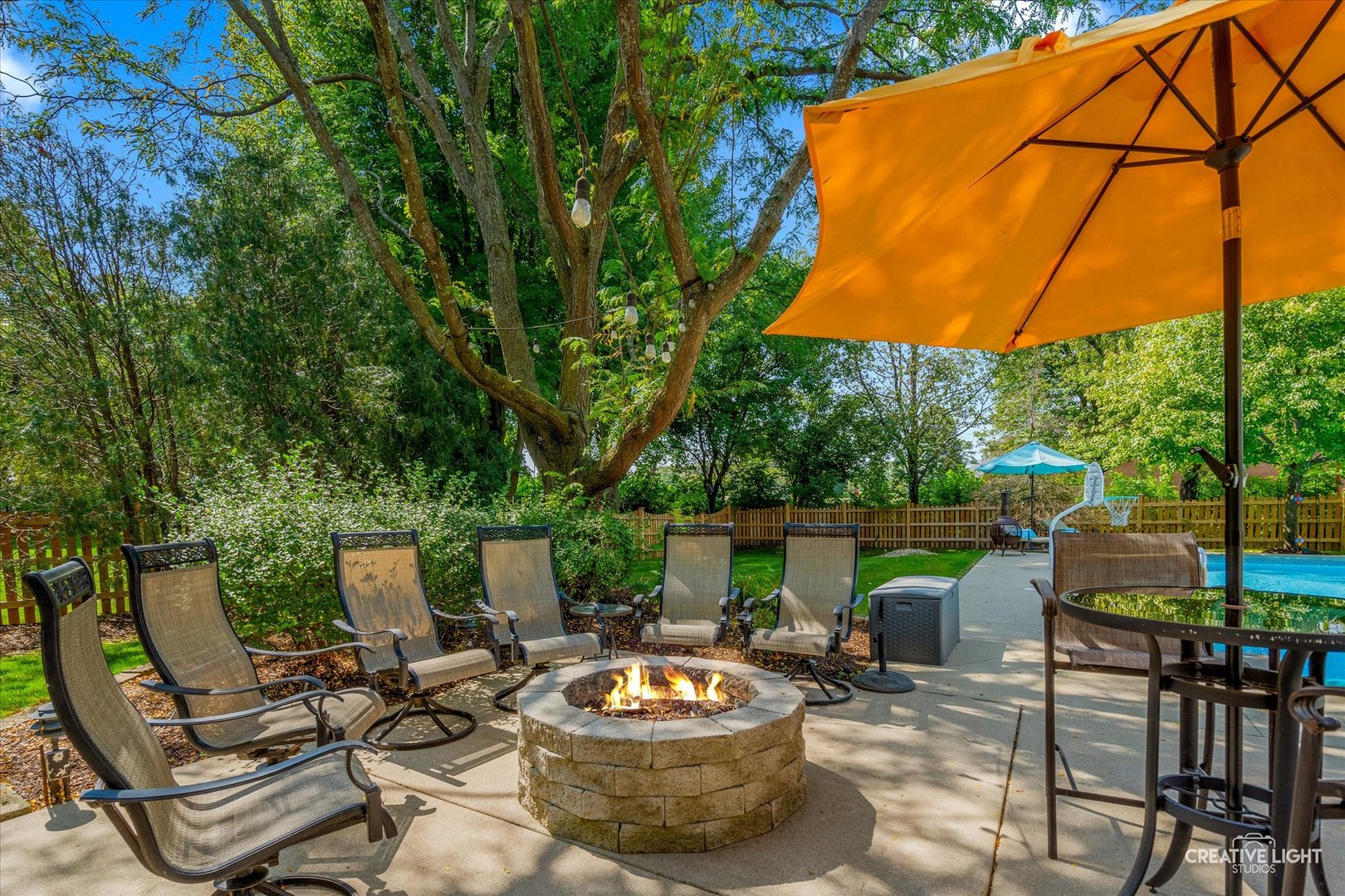 4811 Sebastian Court Naperville, IL 60564 - Photo 31 of 49 a view of a patio with chairs and a table and chairs under an umbrella