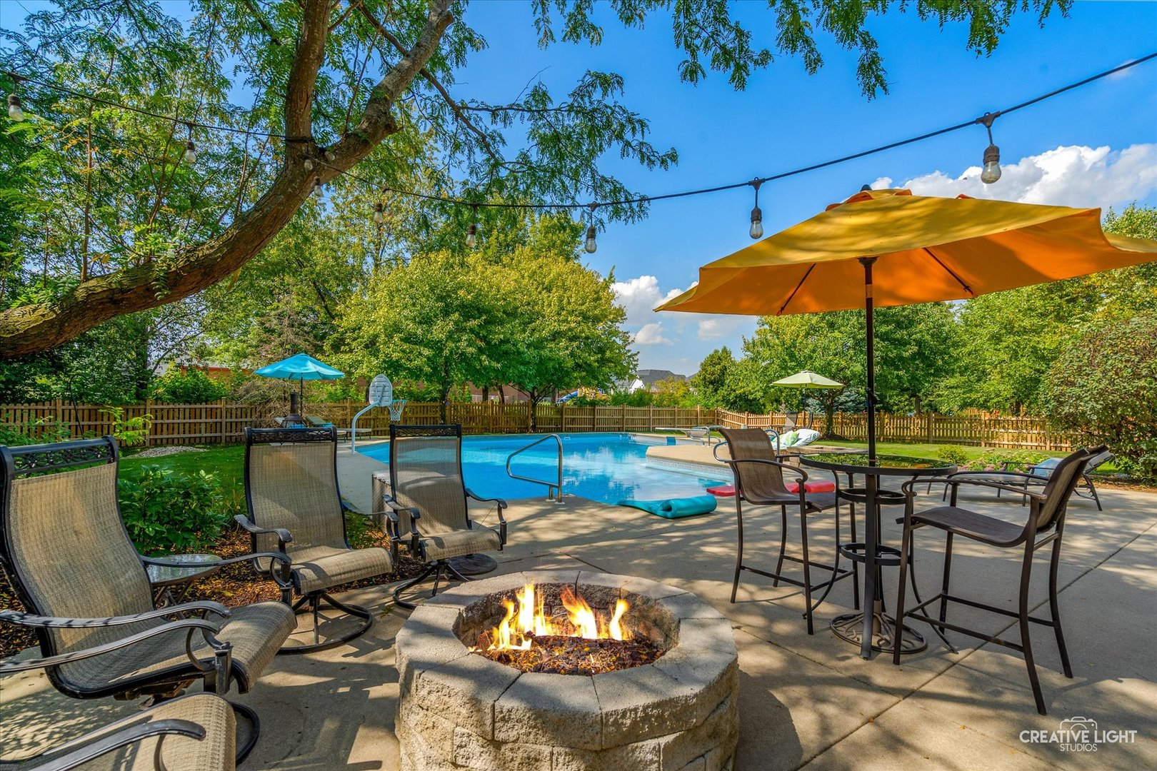 4811 Sebastian Court Naperville, IL 60564 - Photo 32 of 49 a view of a patio with chairs under an umbrella