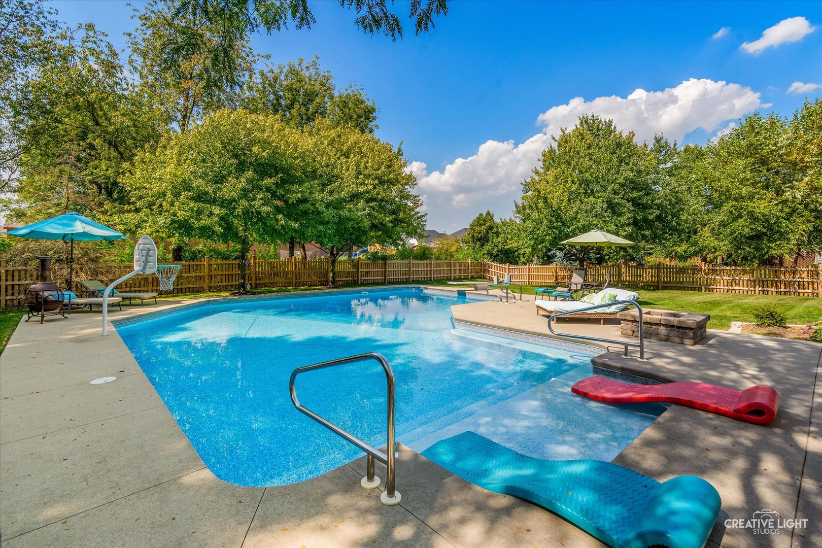 4811 Sebastian Court Naperville, IL 60564 - Photo 33 of 49 a view of a swimming pool with a patio and a yard