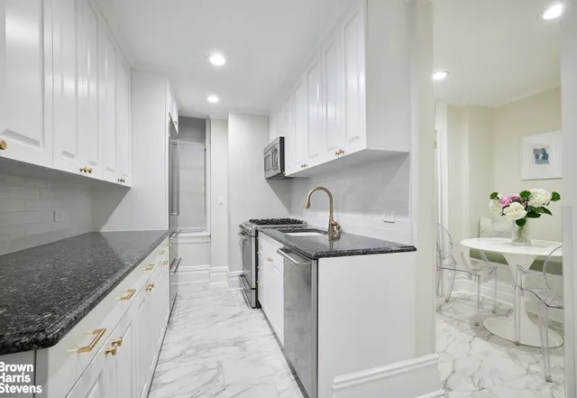 a dining room with furniture and flowers