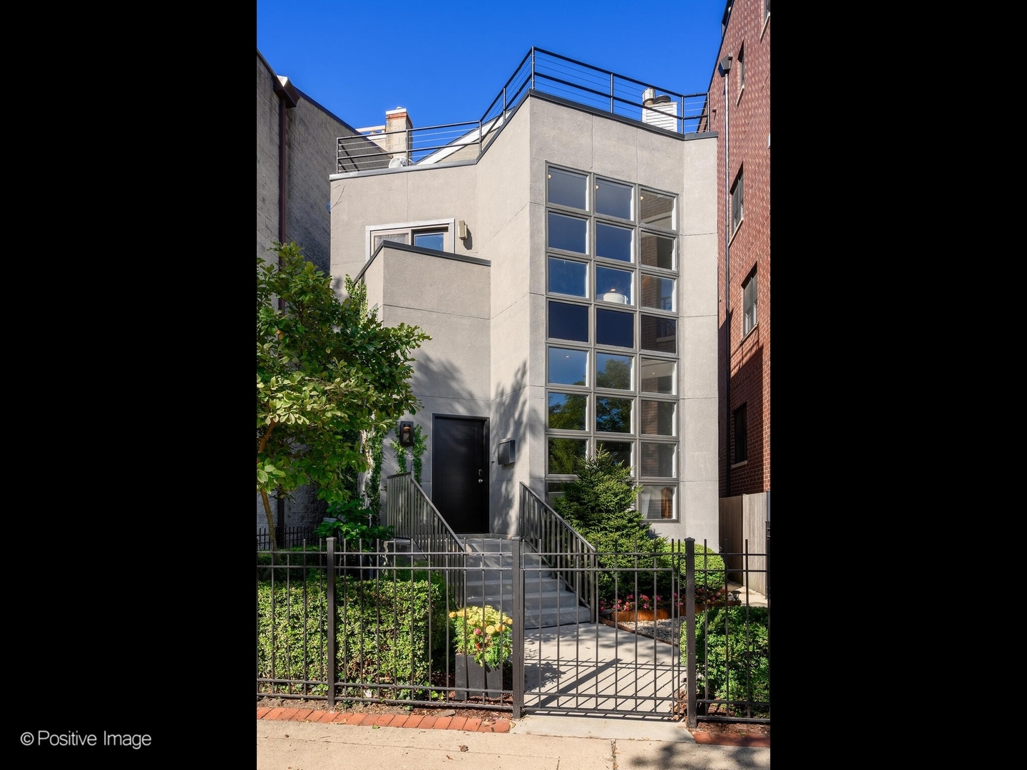 2034 North Burling Street Chicago, IL 60614 - Photo 1 of 32 a front view of a building with garden