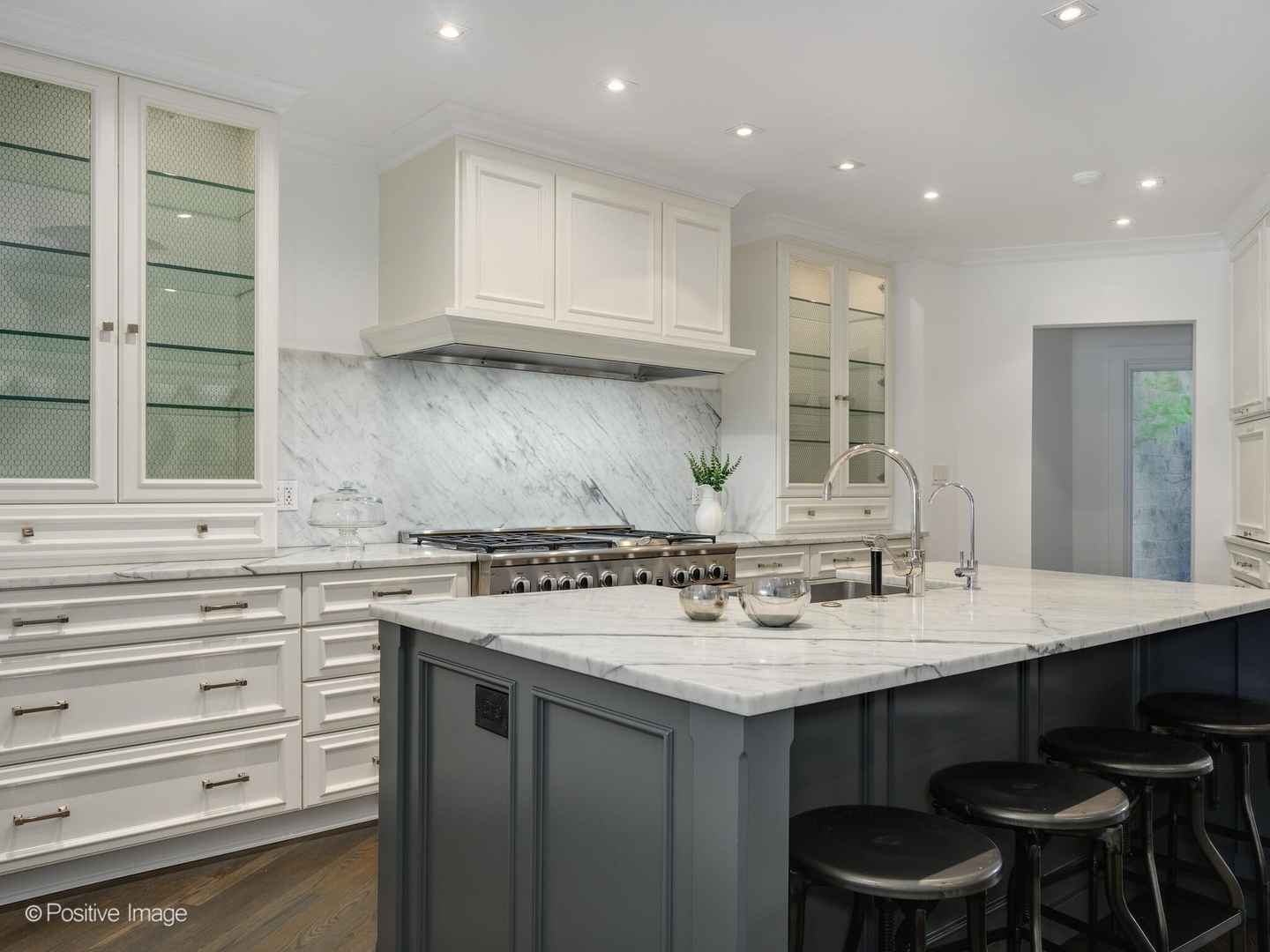 2034 North Burling Street Chicago, IL 60614 - Photo 11 of 32 a kitchen with a sink cabinets and wooden floor