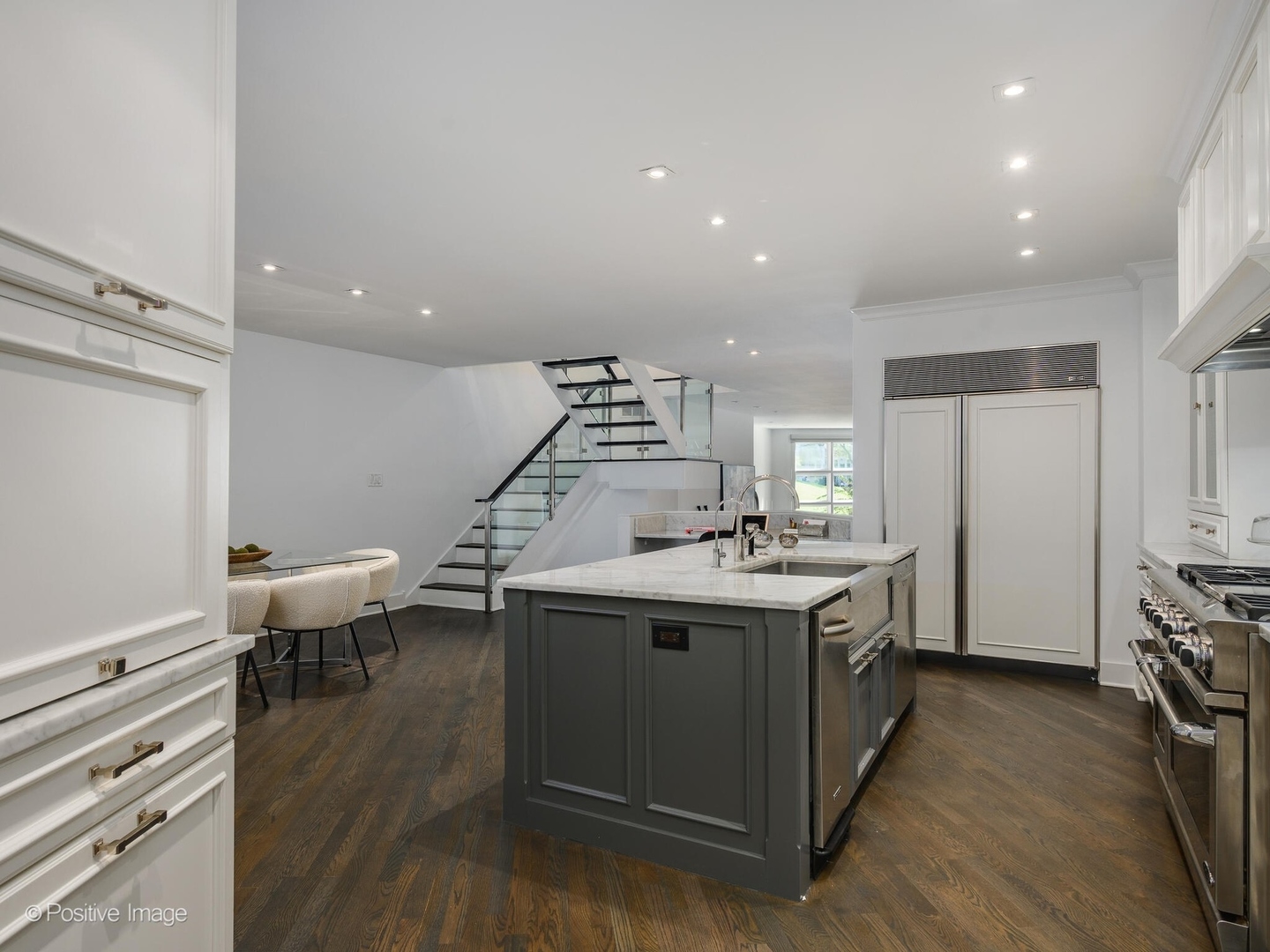 2034 North Burling Street Chicago, IL 60614 - Photo 12 of 32 a kitchen with a sink cabinets and wooden floor