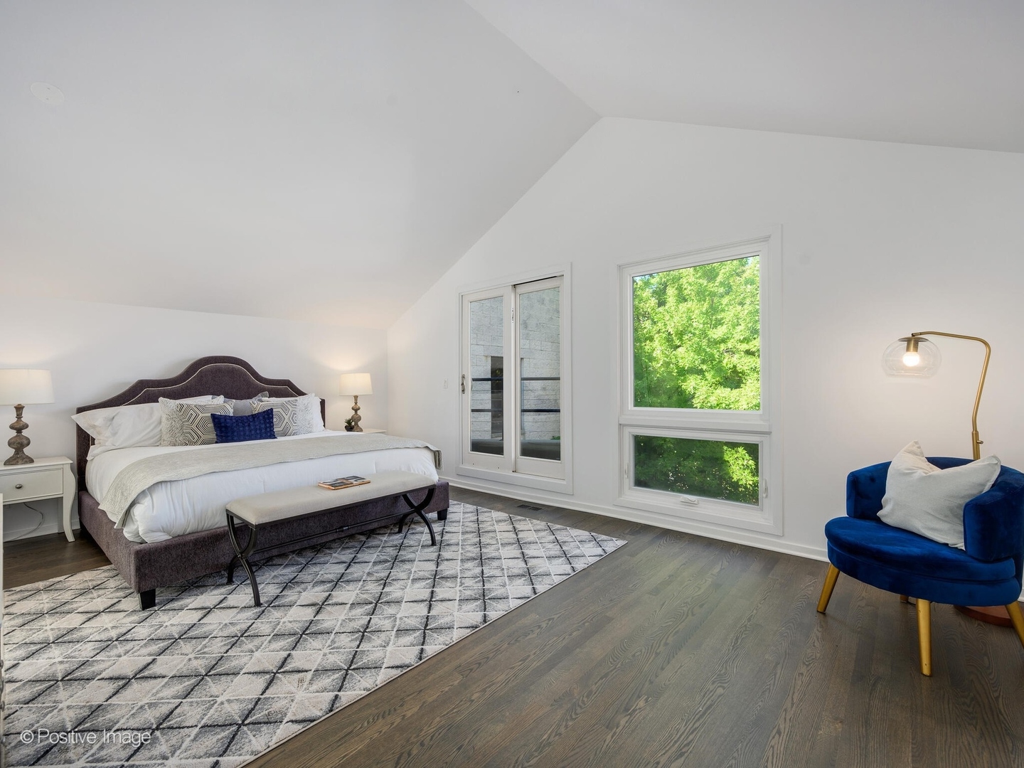2034 North Burling Street Chicago, IL 60614 - Photo 22 of 32 a bedroom with a bed a mirror and a window