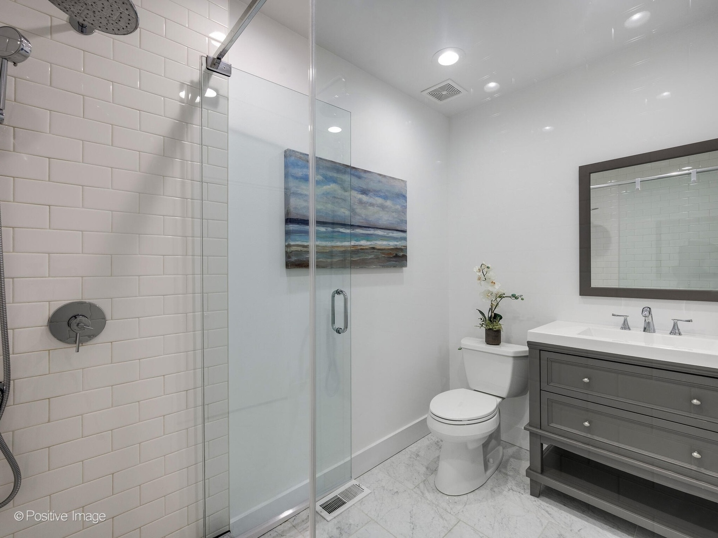 2034 North Burling Street Chicago, IL 60614 - Photo 23 of 32 a bathroom with a toilet sink shower and mirror