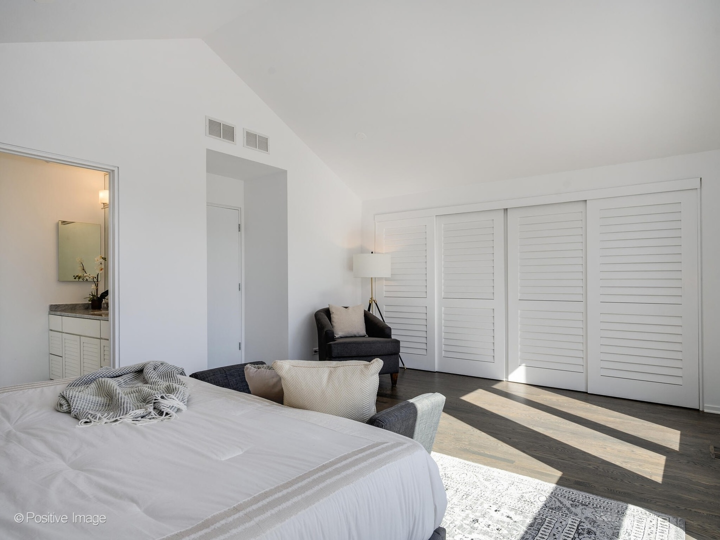 2034 North Burling Street Chicago, IL 60614 - Photo 27 of 32 a bedroom with a bed and a mirror