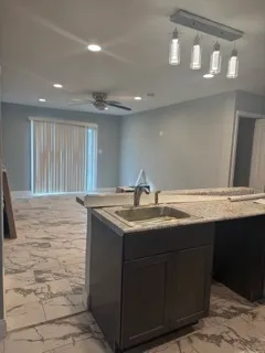 a bathroom with a sink and a wooden cabinets
