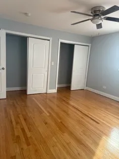 a view of an empty room and wooden floor