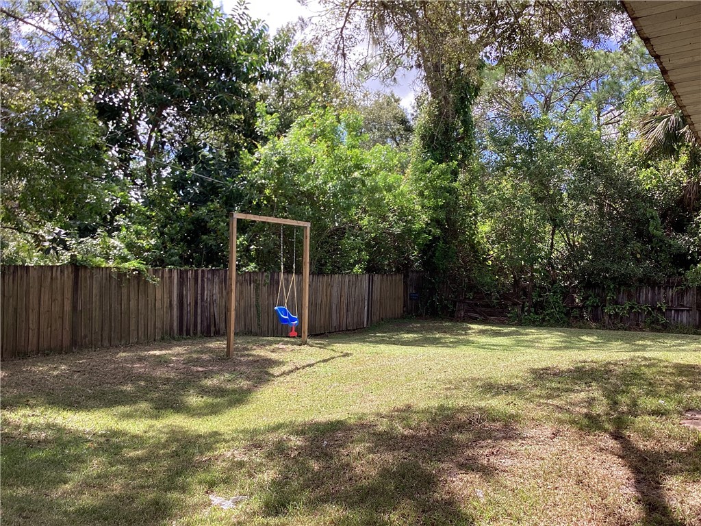 8001 Roberts Road Fort Pierce, FL 34951 - Photo 3 of 29 a view of swimming pool with a small yard