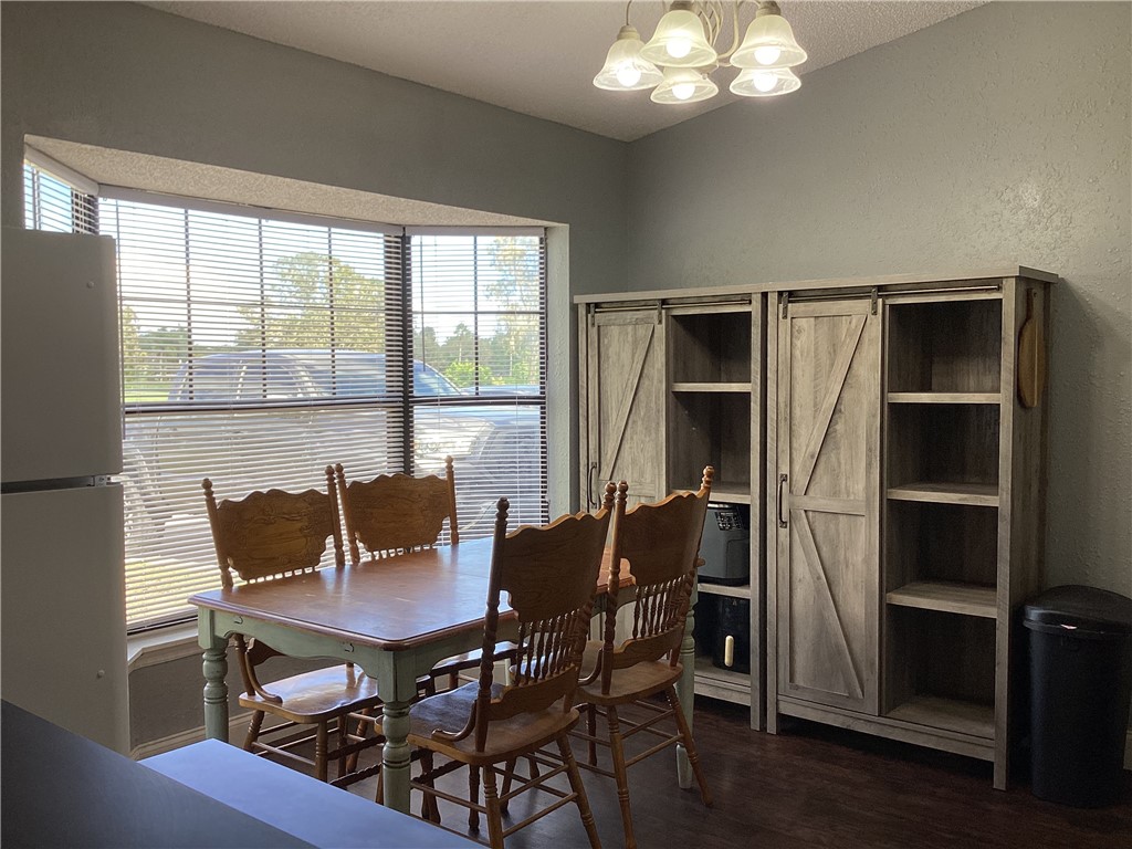 8001 Roberts Road Fort Pierce, FL 34951 - Photo 7 of 29 a view of a dining room with furniture and window
