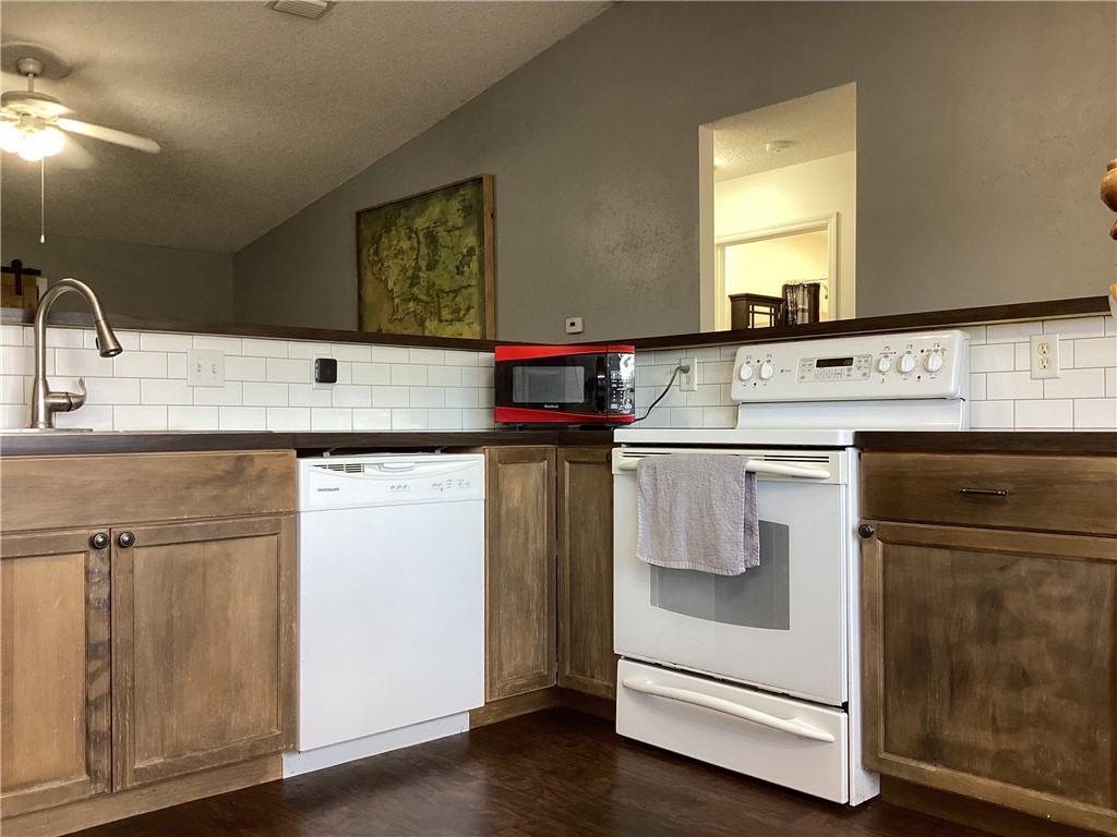8001 Roberts Road Fort Pierce, FL 34951 - Photo 10 of 29 a kitchen with stainless steel appliances granite countertop a sink and a cabinets