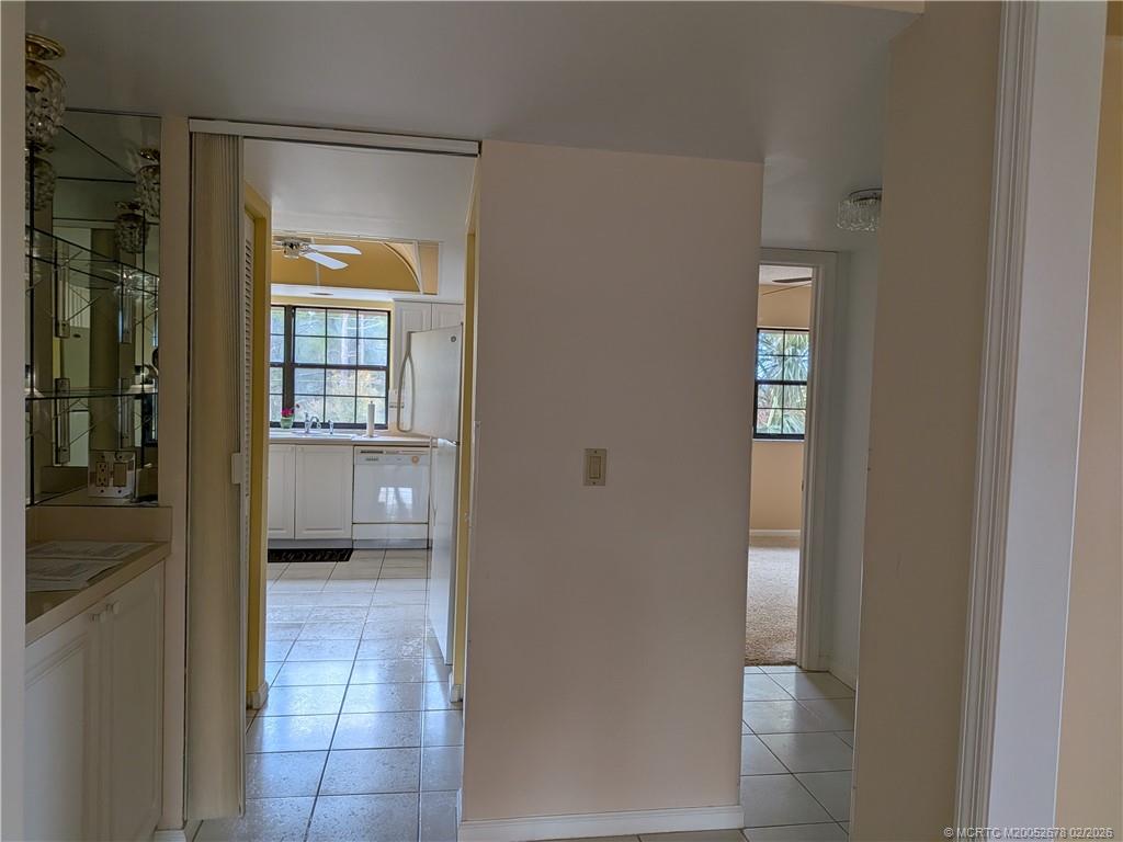 3100 Southeast Pruitt Road, Unit B301 Port St. Lucie, FL 34952 - Photo 18 of 40 Hall bath and 2nd bedroom to right