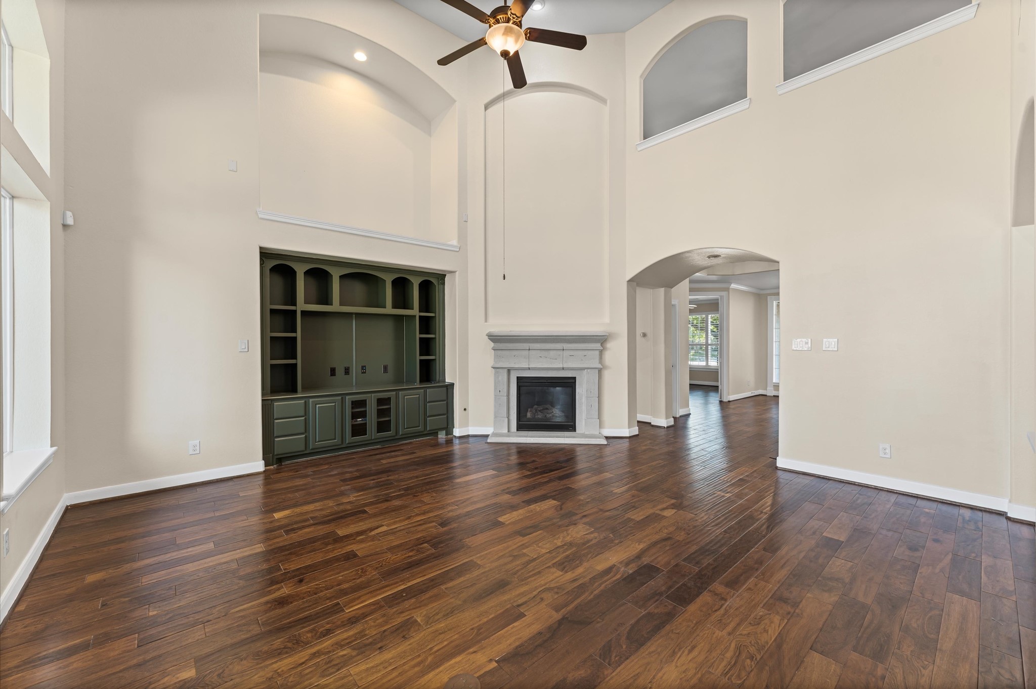 7 North Beech Springs Circle Spring, TX 77389 - Photo 11 of 50 a view of empty room with wooden floor and fireplace