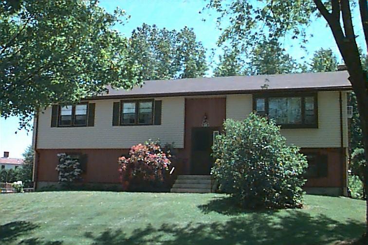 21 Hansom Hill Road Windsor, CT 06095 - Photo 1 of 1 a front view of a house with garden