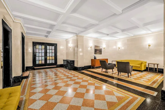 a bathroom with a granite countertop toilet sink and shower
