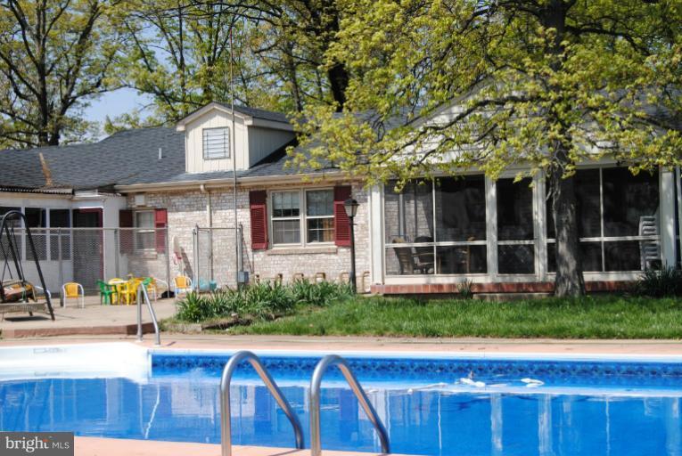 600 Union Bridge Road Union Bridge, MD 21791 - Photo 1 of 17 a view of a house with a swimming pool and a yard with wooden fence
