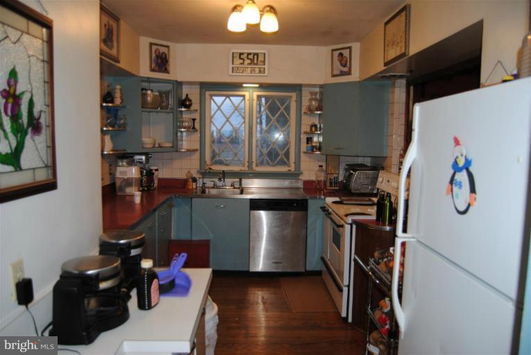 600 Union Bridge Road Union Bridge, MD 21791 - Photo 12 of 17 a kitchen with stainless steel appliances granite countertop a refrigerator and a stove