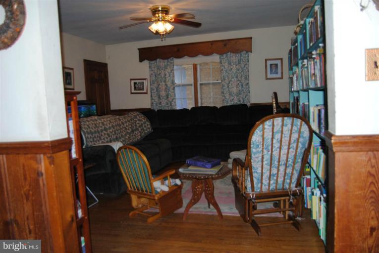 600 Union Bridge Road Union Bridge, MD 21791 - Photo 15 of 17 a living room with furniture and a chandelier